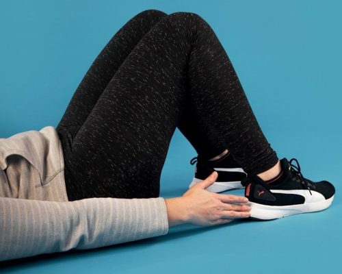 person lying on blue surface